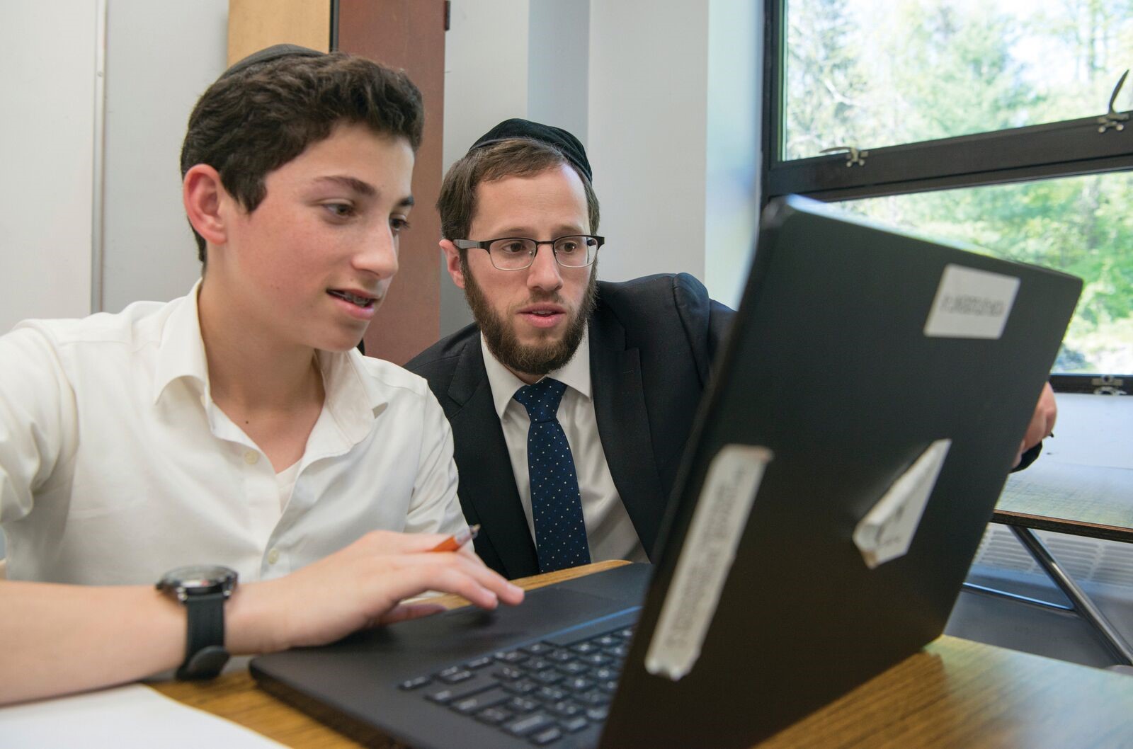 Rabbi Zev Fuchs, with a student.